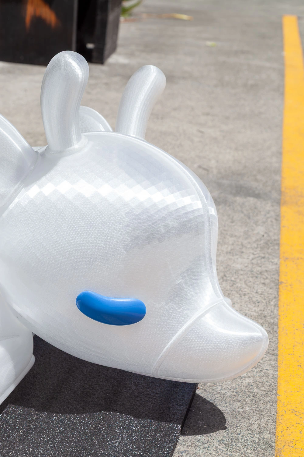 Close-up of the reclining reindeer's translucent head and blue eyelid