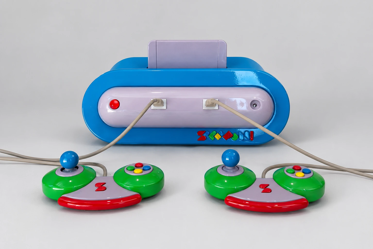 Blue Superfun console with two green controllers and a plain cartridge during the physical build